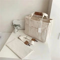 Sac de rangement pour couche avec sangle