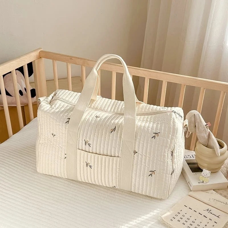 Sac a langer en gaze de coton dans un lit bébé