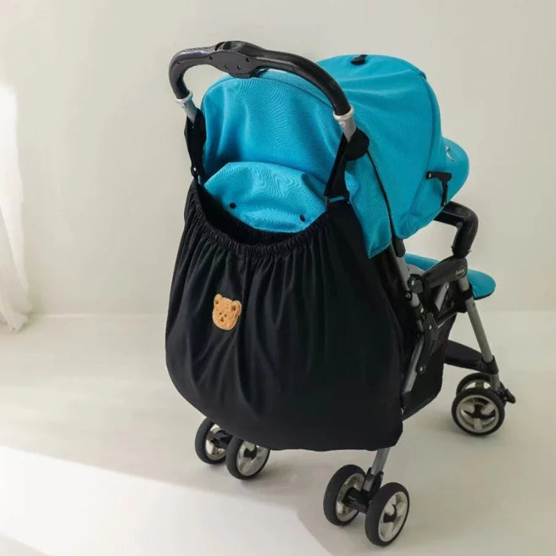 Sac rangement suspendu à une poussette