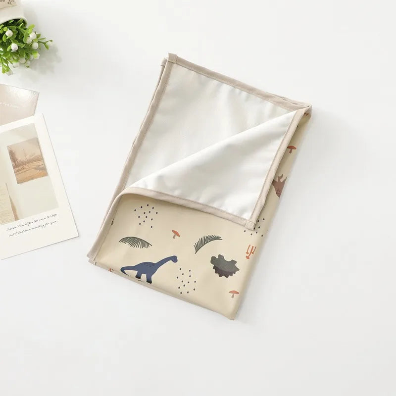 Tapis à langer nomade pour bébé dinosaure