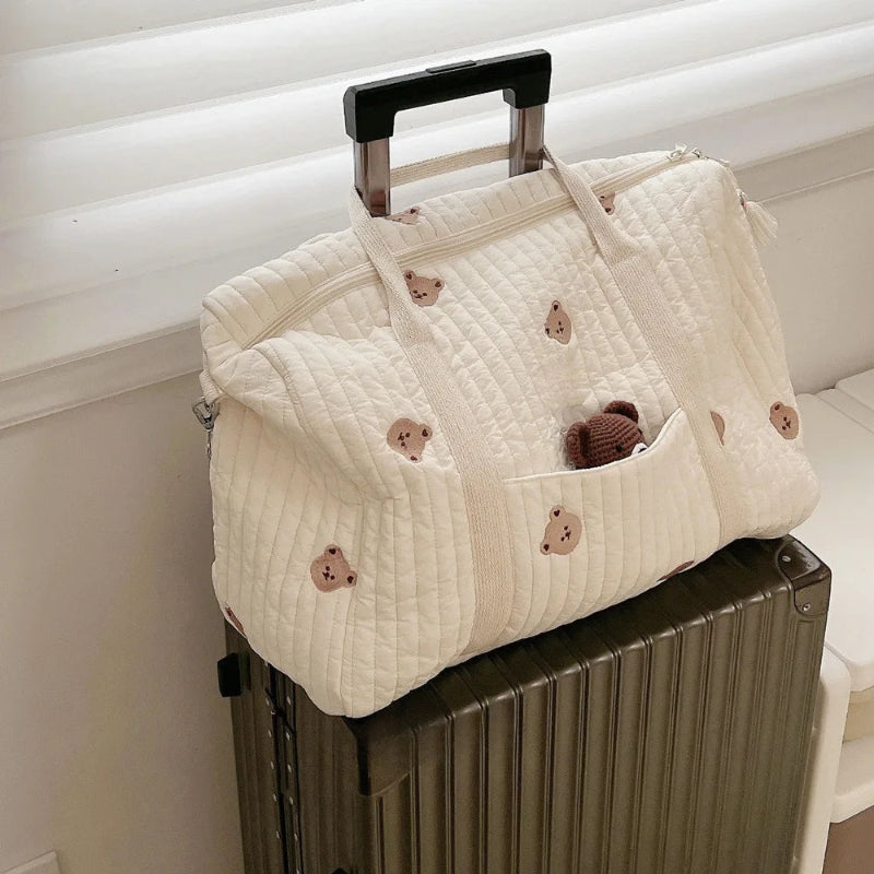 Grand sac à langer avec bandoulière sur valise