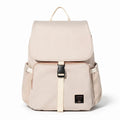 Sac à langer à dos beige sur fond blanc